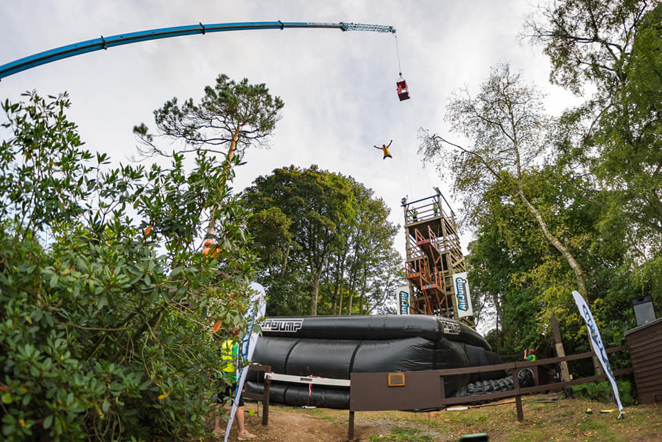Benjamin Moesel jumping from a crane